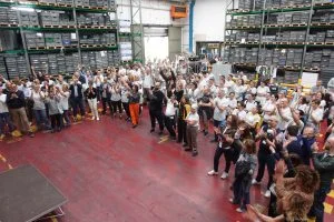 group photo of workers in a manufacturing setting in budrio italy